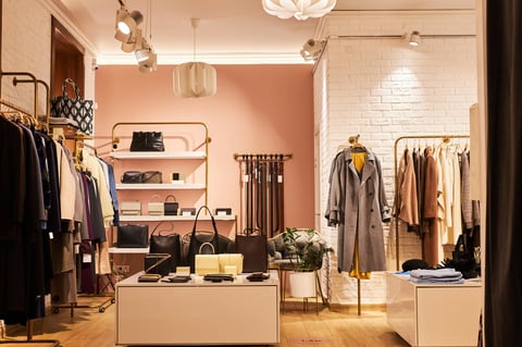 Background image of elegant clothing boutique interior
