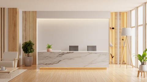 Modern minimalist reception area featuring a marble front desk
