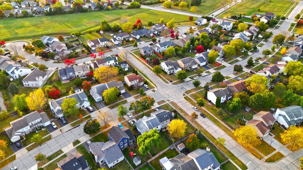 Aerial view of suburban neighborhood with diverse homes